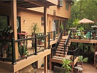 <b>Multi-level TimberTech Reserve Antique Leather composite decking with black Ultralox aluminum railing with glass picket infills 2</b>